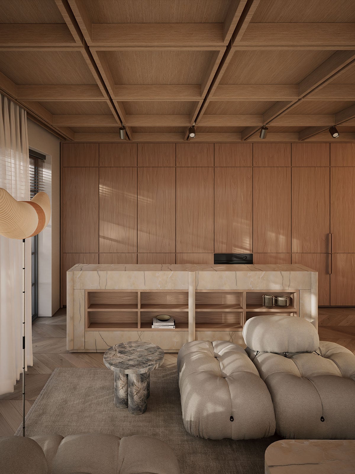 Concealed kitchen in oak to the back, with a stone side table and modular cream sofa in the foreground.