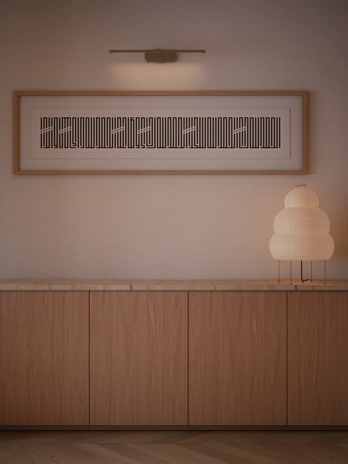 Straight-on view of the low oak storage unit, with a framed art piece above and an Akari lamp.