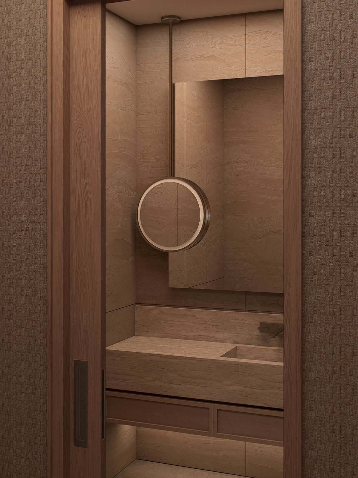 Washroom vanity in travertine with an integrated sink and a round mirror above.