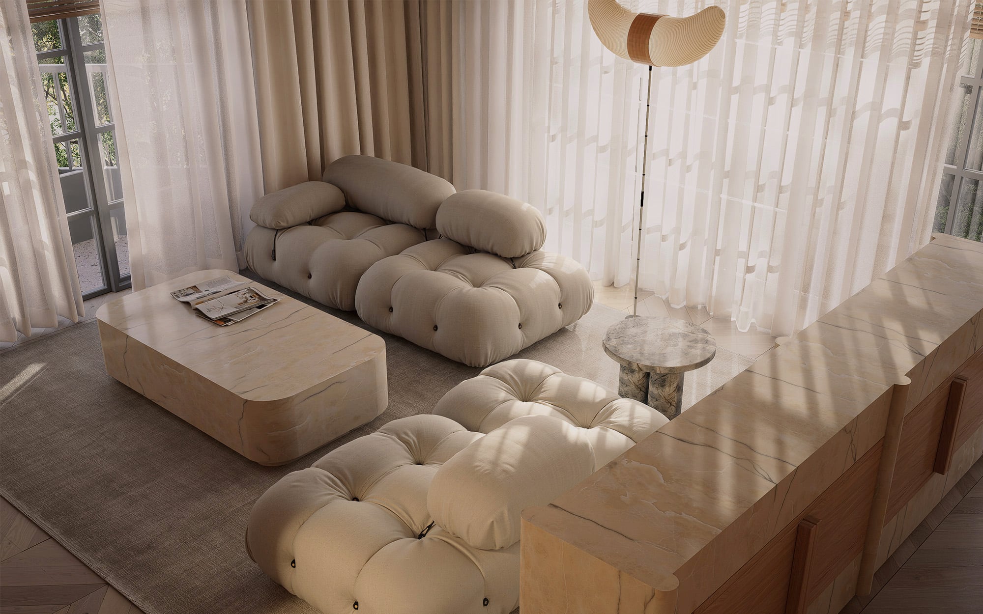 Wide view of the living room with a cream modular sofa, marble coffee table, and sheer curtains framing the terrace doors.